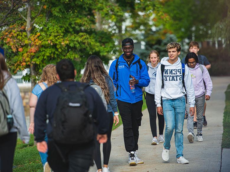 Penn State Altoona students walking to and from class near the reflecting pond